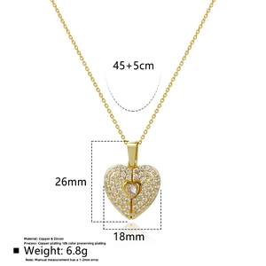 Detail view of 18K gold-plated heart pendant with dimensions 26x18mm and zircon settings