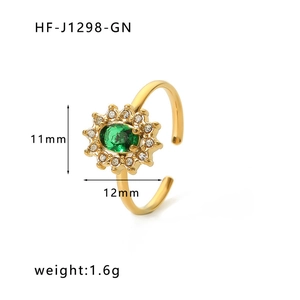 Detail of 18K gold adjustable ring with oval green zircon in sunburst halo setting