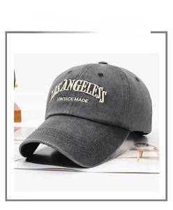 Close-up of Los Angeles 3D embroidery on vintage washed grey cotton baseball cap