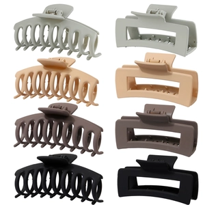 Detail of 8-pack large matte hair claws in cross and rectangular shapes and four colors