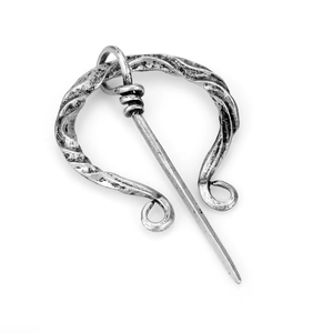Vintage silver Celtic ring brooch with twisted texture on professional white background