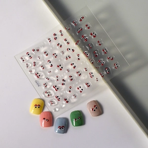 3D embossed nail stickers featuring cute cartoon big eyes with red and black accents
