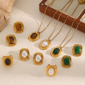 Vintage stainless steel jewelry set featuring amber stone necklaces and gold-plated rings
