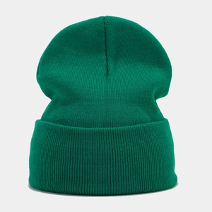 Detailed texture of dark green knitted beanie with elastic ribbed pattern and folded cuff