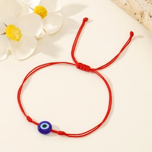 Bracelet cordon rouge minimaliste avec perle en verre œil grec bleu et nœud réglable