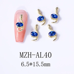 Golden snake nail charm with blue gemstone, 6.5x15.5mm size detail for manicure
