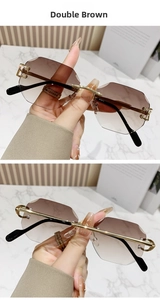 Detail of rimless polygon sunglasses with gradient brown lenses and gold metal temples