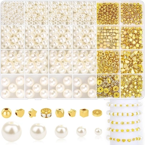 Macro detail of white faux pearls and gold spacer beads set for DIY jewelry making