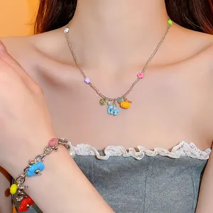 Vibrant dopamine-style stainless steel jewelry set with elephant and pumpkin charms