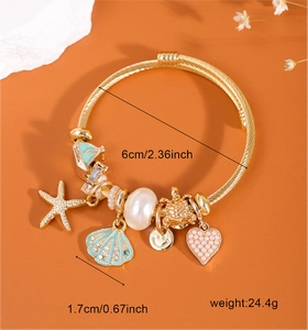 Detailed view of ocean-themed charm bracelet with shell, starfish and size dimensions