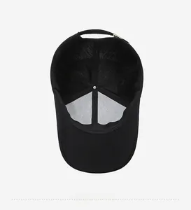 Detailed interior view of a black baseball cap showing reinforced seams and peak structure