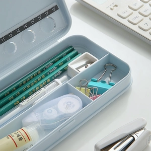 Light blue multi-layer plastic stationery box with pencils and built-in ruler lid