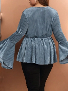 Slim fit deep V-neck top in dusty blue with textured flare sleeves and ruffle hem design