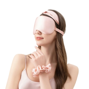 Pink 22 momme silk sleep set with eye mask, headband and scrunchie on model
