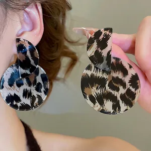 Fashionable leopard print resin drop earrings with a vintage geometric round design