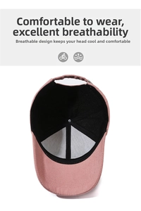 Internal detail of pink baseball cap showing breathable vent holes and reinforced lining