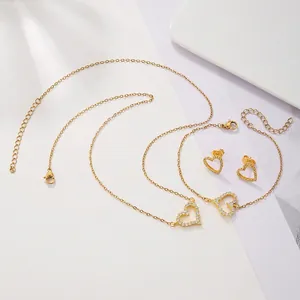 Golden heart jewelry set with necklace bracelet and earrings featuring full zircon pavé