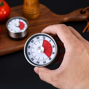 Mechanical kitchen timer with red visual countdown disk in silver stainless steel shell