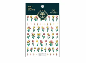 Detail of 5D embossed nail art stickers with gradient tulips and gold star accents