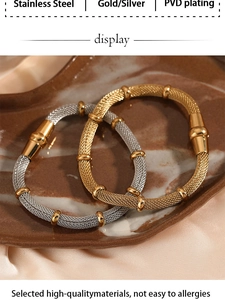 Detailed macro of mesh weave stainless steel bracelets in gold and silver finish