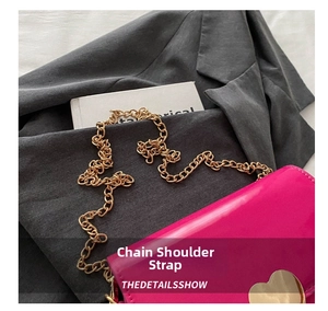 Close-up of vibrant rose pink patent leather bag featuring a gold heart lock and chain strap