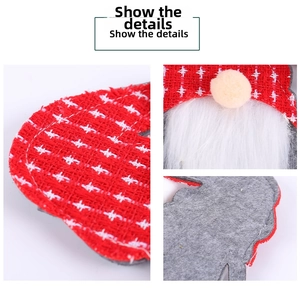 Macro detail of Christmas gnome cutlery holder with red plaid fabric and faux fur beard