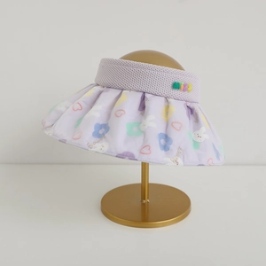 Detail of light purple sun visor with quilted brim and colorful rabbit floral patterns