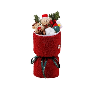 Christmas bouquet with teddy bear, reindeer plush, pine cones and red berries in a red bucket