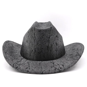 Close-up of marble texture on a dark grey vintage PU leather western cowboy hat