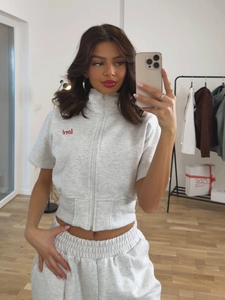 Women's grey two-piece tracksuit with short sleeve zip hoodie and high waist joggers