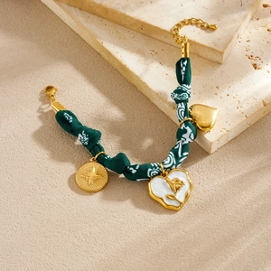 French vintage fabric rope bracelet with gold-plated heart and flower charms
