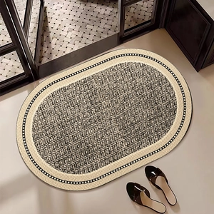 Oval diatom mud bath mat with geometric pattern and anti-slip backing for bathrooms