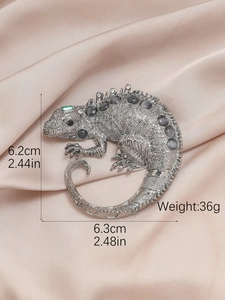 Lizard brooch size detail 6.3x6.2cm with grey gems on champagne silk background