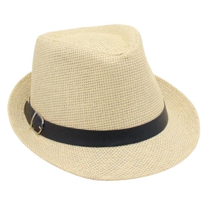 Detail of the woven straw fedora hat texture with a black belt and silver buckle