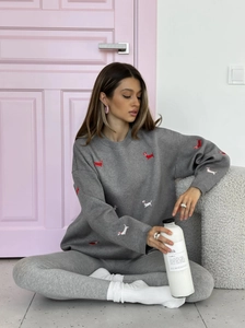 Grey knit sweater featuring all-over red and white dachshund embroidery with a crew neck