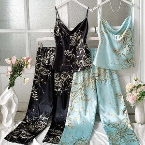 Elegant satin floral pajama set with V-neck camisole top and high-waist trousers