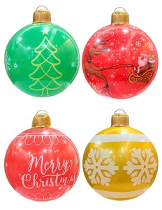 Detail of four inflatable Christmas balls with festive patterns and gold hanging loops