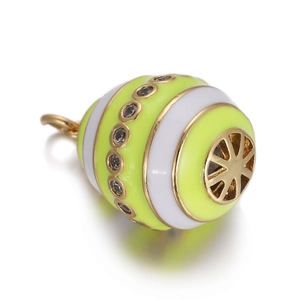Macro view of colorful enamel egg pendant with gold trim and white zircon accents