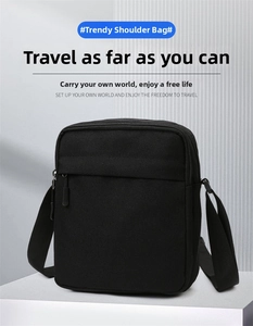 Low angle view of a vertical black nylon messenger bag on a minimalist display stand