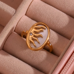 Detail of 18K gold plated ring with white oval inlay and small diamond accents