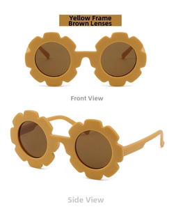 Close-up detail of yellow flower-shaped kids' sunglasses with tea-colored lenses