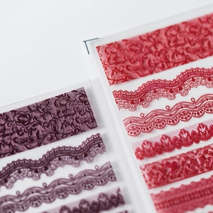 Detailed 3D lace nail art stickers in deep purple and bright red vintage rose designs