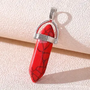 Macro shot of red hexagonal natural stone pendant with black veined patterns and silver clasp