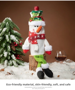 Detailed view of Christmas snowman wine bottle cover with red scarf and plush details