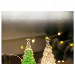 Detail of crystal Christmas tree light showing battery compartment and LED glow effect