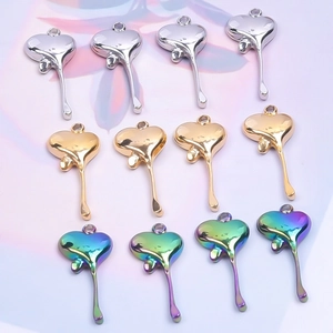 Polished stainless steel heart drop pendants in gold, silver, and rainbow finishes