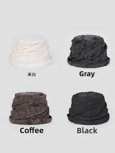 Detailed grid view of knitted bucket hats showing distressed holes in beige, grey, and coffee