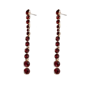 Elegant vintage tassel earrings with deep red rhinestones and gold-tone finish