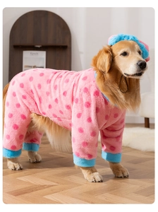 Polka dot dog pajamas detail showing plush pink flannel fabric and matching pet hat