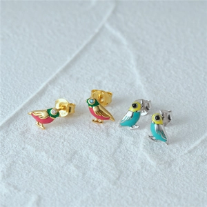Close-up of S925 sterling silver bird stud earrings with colorful enamel and tiny crystals